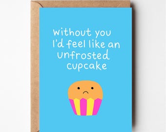 May include: A blue card with the text "Without you I'd feel like an unfrosted cupcake" in white. A cartoon cupcake with a sad face is below the text.