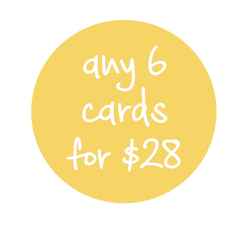 May include: A yellow circular graphic with the text "any 6 cards for $28" in white handwritten font. The graphic is set against a white background.