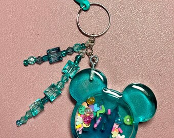 Disney Mickey Mouse resin shaker keychain with clip and 2 strings of beads. Two styles to choose from. Keep for yourself or give as a gift