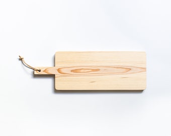 Rectangular cutting board with rounded corners, handle