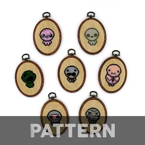 May include: Eight embroidered hoop art pieces featuring pixelated characters from the video game "The Binding of Isaac". The characters are in various poses and expressions, including a green monster, a pink creature, and a grey figure.