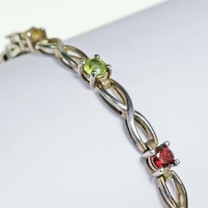 Sterling silver 7.25&quot; gemstone bracelet with brilliant cut amethyst, garnet, peridot, citrine and spinel