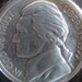 Vintage glass paperweight of Thomas Jefferson nickel