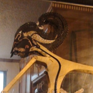 antique WAYANG KULIT shadow puppet from Indonesia, leather with black horn handles