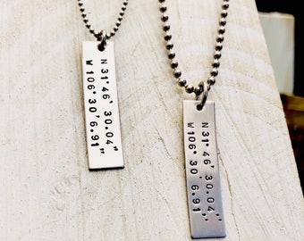 His and hers coordinates necklaces .