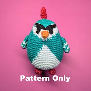 May include: Crochet pattern for a teal and white amigurumi penguin with a red beak and black eyes. The penguin has a red crest on its head. The pattern is for a crocheted toy. "Pattern Only" is written below the penguin.