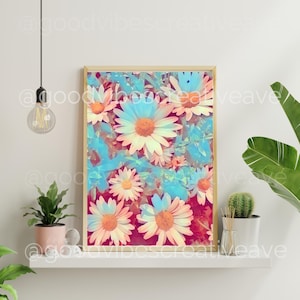 May include: A framed print of a floral design featuring pink and blue daisies on a red background.