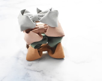 Faux Suede Bow: Strong Grip Hair Clip or Nylon Headband
