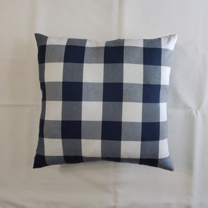 May include: A blue and white checkered throw pillow. The pillow is made of a soft, comfortable fabric and is perfect for adding a touch of style to any room.