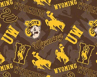 NCAA UNIVERSITY of WYOMING COWBOYs Watermark Print Football 100% cotton fabric material, you choose the length, licensed