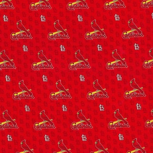 May include: Red fabric with a repeating pattern of a red cardinal bird holding a baseball bat with the word "Cardinals" written below. The background is filled with the letter "S" in white.