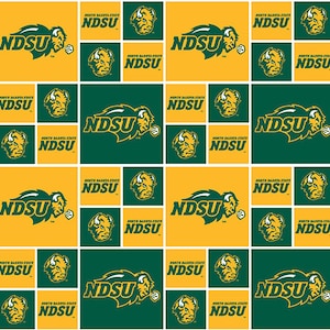 May include: A green and yellow fabric with a repeating pattern of the North Dakota State University Bison logo. The logo features a bison head with the text "NDSU" in a bold, white font.