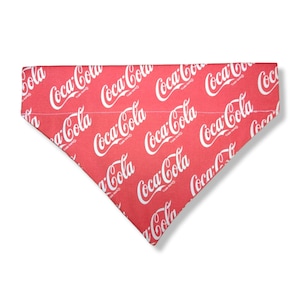 May include: Red bandana with a white Coca-Cola logo pattern.