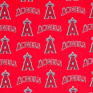 May include: Red fabric with a repeating pattern of the Los Angeles Angels baseball team logo. The logo features a stylized 'A' with a halo above it and the word 'ANGELS' written in a curved arc above the 'A'.