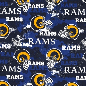 May include: A blue and white fabric with a repeated pattern of a football helmet and the word "RAMS".