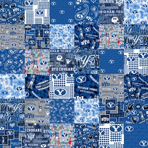 May include: A patchwork design featuring BYU Cougars logos and text in shades of blue and white. The design includes various patterns, such as paisley, polka dots, and the BYU logo. The overall theme is collegiate sports.