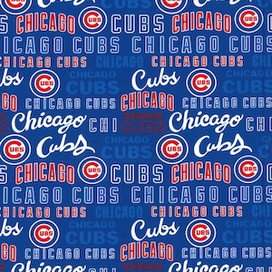 May include: A blue and white fabric with a repeating pattern of the Chicago Cubs logo, the words "Chicago Cubs", and the words "UBS".