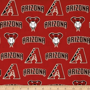 May include: Red fabric with a repeating pattern of the Arizona Diamondbacks logo, a stylized 'A' with a star inside, and a red snake with a baseball in its mouth. The text 'Arizona' is repeated throughout the fabric.