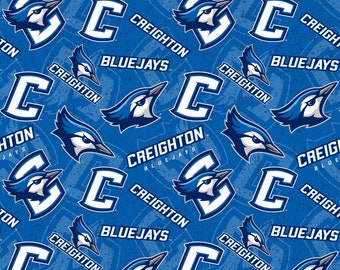 NCAA CREIGHTON BLUEJAYS Watermark Print Football 100% cotton fabric material, you choose length, licensed for Quilts, Crafts