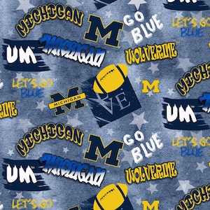 NCAA MICHIGAN WOLVERINES Sprayed Print Football 100% cotton fabric material, you choose length, licensed for Quilts, Crafts