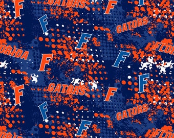 NCAA FLORIDA GATORS Splatter Print Football 100% cotton fabric material you choose length licensed Quilts