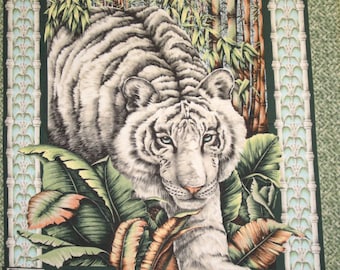 May include: A white tiger with black stripes walks through a lush green jungle setting. The tiger is surrounded by bamboo stalks and large green leaves. The image is framed with a decorative border.