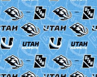 May include: Light blue fabric with a repeating pattern of the Utah Mammoth logo and text. The logo features a stylized mammoth head in black and white, and the text reads "UTAH MAMMOTH".