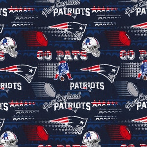 May include: A navy blue fabric with a repeating pattern of the New England Patriots logo, footballs, stars, and the words "New England Patriots" and "Go Pats".
