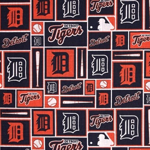 May include: A black and orange fabric with a repeating pattern of baseball bats, baseballs, and the Detroit Tigers logo. The text "Detroit Tigers" appears in a stylized font.