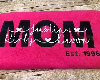 HOTTEST shirt of the season ! MOM est shirt with kids name . Perfect for Valentines Day or Mothers Day!!