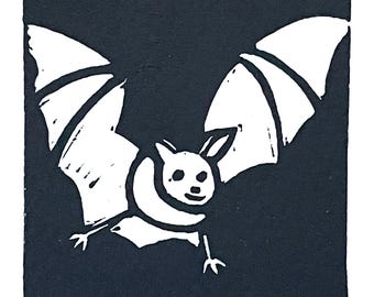 Linoleum block print of a bat