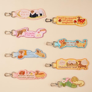 Dobe & Friends-sleutelhanger met goede woordspeling borduren