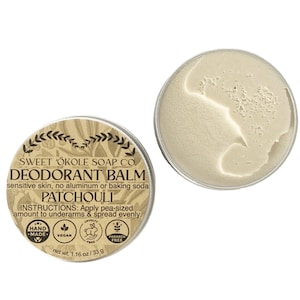 May include: A small tin of natural deodorant balm with a brown label that reads "Sweet 'Okole Soap Co. Deodorant Balm Sensitive skin, no aluminum or baking soda Patchouli Instructions: Apply pea-sized amount to underarms & spread evenly. Hand-made, Vegan, Cruelty-free, Paraben-free. Net wt. 1.16 oz/33 g"