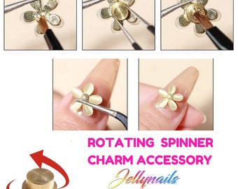 May include: A gold rotating nail charm accessory in the shape of a flower. The charm is 5 mm in diameter and 2.5 mm in height. The charm is shown being applied to a fingernail with tweezers.