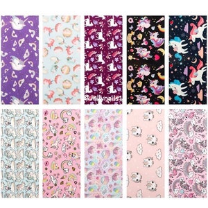 May include: Ten sheets of nail art decals featuring various unicorn designs. The designs include unicorns with rainbows, stars, hearts, and flowers. The decals are printed on a clear background.