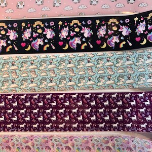 May include: Five different rolls of colourful patterned washi tape featuring unicorns, rainbows, clouds, stars, and hearts. The washi tape is perfect for adding a touch of whimsy to your crafts, journals, and planners.