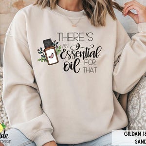 Essential Oil Sweatshirt There&#39;s an Oil For That Holistic Healing Aromatherapy Oils Floral Accents Around Oil Bottle Natural Oil Remedies