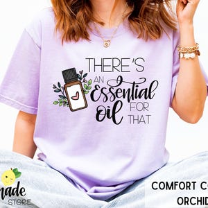 Essential Oil Shirt for Advocates Holistic Healing Aromatherapy Essential Oils Floral Accents Around Oil Bottle Natural Oil Remedies