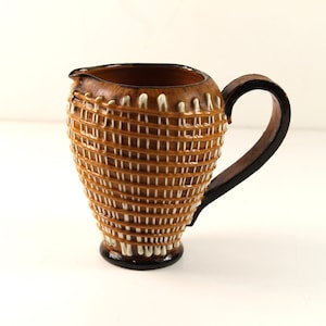 A 1950&#39;S / 1960&#39;S Italian relief decorated jug possibly Fratelli Fanciullacci.