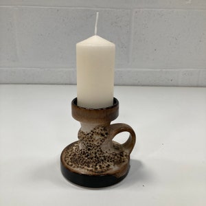 A 1970s Lava glaze candle stick.