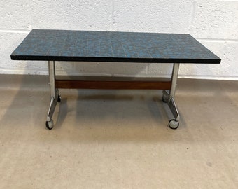 A 1970s teal marbled tile topped coffee table