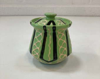 A Midcentury green jam pot.
