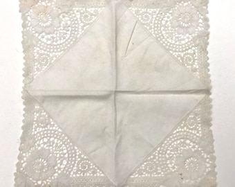 A vintage cotton Handkerchief with had laced edges