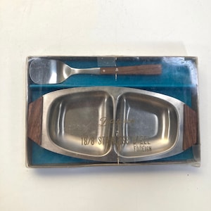 A vintage Daysun teak and stainless steel butter dish and spreader