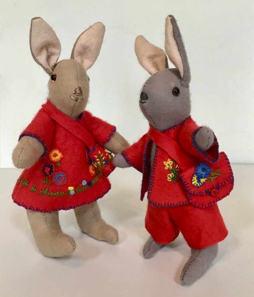 A traditional hand-made female and male felt rabbit Rosie and Rupert