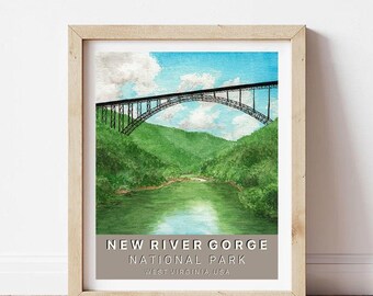 May include: Framed watercolour print of the New River Gorge Bridge in West Virginia, USA. The image shows a black bridge over a green valley and river, under a blue sky with clouds. The text at the bottom reads "New River Gorge National Park". The frame is light wood.
