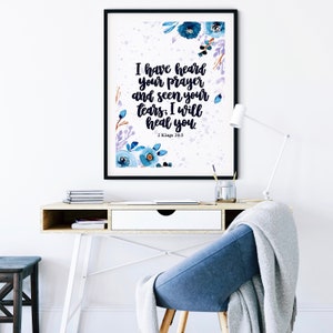 May include: A watercolor print with blue flowers and a white background. The print features the text "I have heard your prayer and seen your tears: I will heal you." and the scripture reference "2 Kings 20:5".