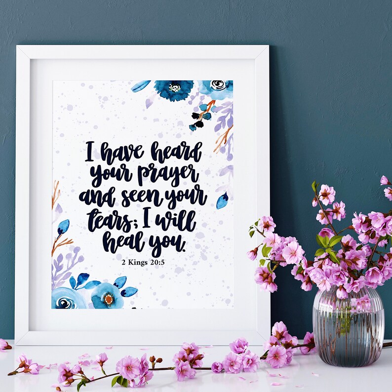 May include: A white framed print with a watercolor floral design and the text "I have heard your prayer and seen your tears; I will heal you. 2 Kings 20:5"