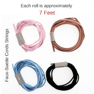May include: Four rolls of faux suede cords in pink, brown, blue, and black. Each roll is approximately 7 feet long.