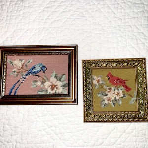 May include: A handmade wooden sign with the text "Welcome to our home" in a handwritten style. The sign is painted white with black lettering and a distressed finish, suitable for indoor or outdoor use.